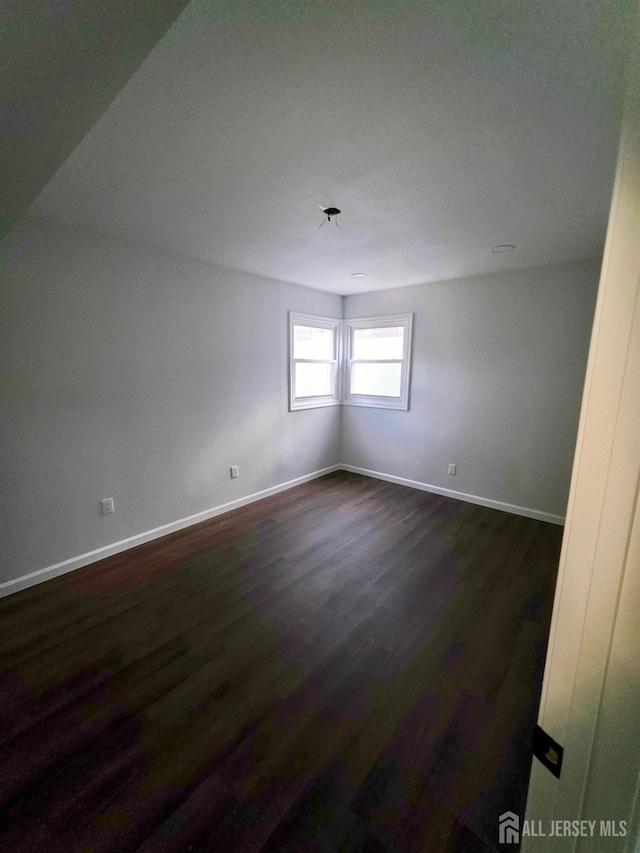 81 Hickory St, Carteret, NJ 07008 - unfurnished room with dark wood-style flooring and baseboards