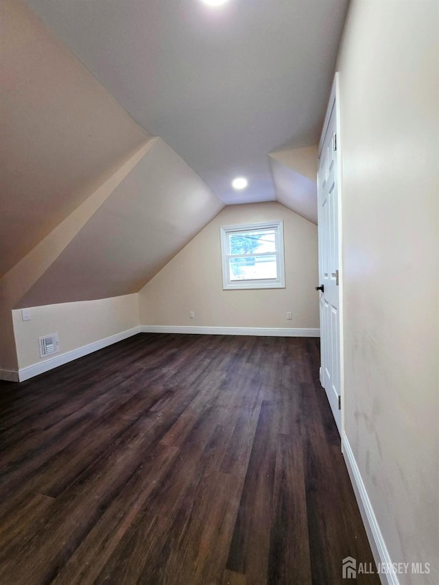 81 Hickory St, Carteret, NJ 07008 - bonus room featuring lofted ceiling and dark wood-type flooring