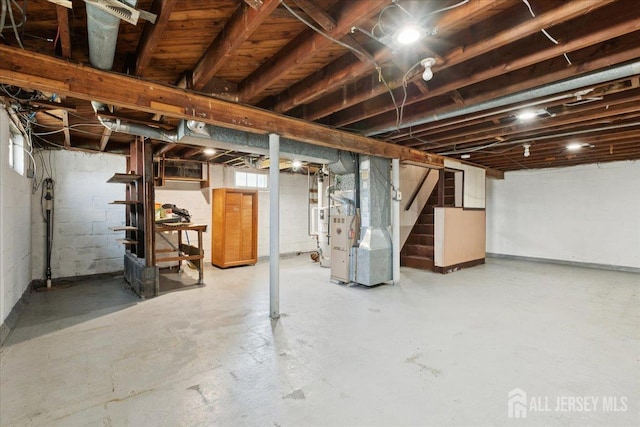 78 Bernard St, Carteret, NJ 07008 - basement featuring stairway, heating unit, and drainage system