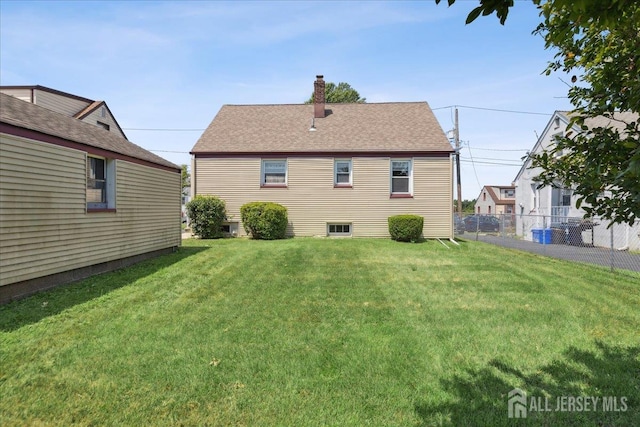 78 Bernard St, Carteret, NJ 07008 - rear view of property featuring a chimney and roof with shingles
