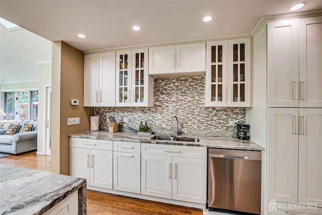 9 NW Fielding Pl, Edison, NJ 08820 - kitchen with stainless steel dishwasher, tasteful backsplash, light wood finished floors, light stone countertops, and recessed lighting