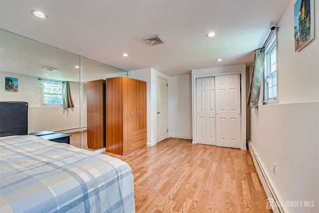 9 NW Fielding Pl, Edison, NJ 08820 - bedroom featuring baseboard heating, light wood-type flooring, and recessed lighting