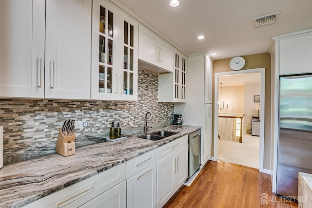 9 NW Fielding Pl, Edison, NJ 08820 - kitchen with appliances with stainless steel finishes, white cabinets, glass insert cabinets, light wood-style floors, and recessed lighting
