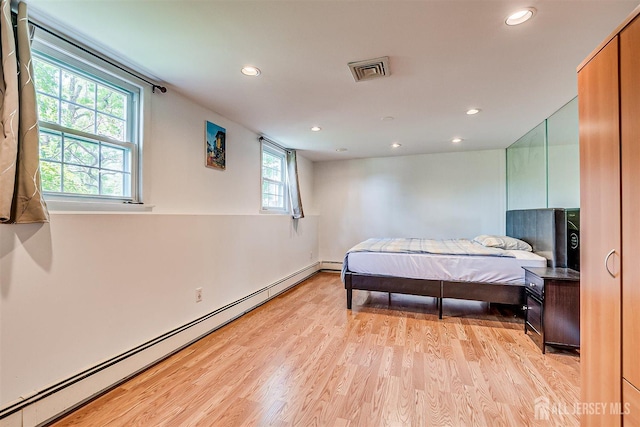 9 NW Fielding Pl, Edison, NJ 08820 - bedroom with a baseboard radiator, recessed lighting, and light wood-type flooring