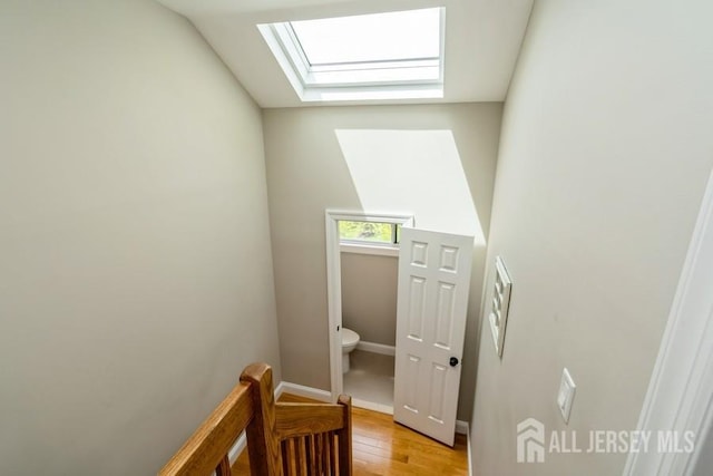 580 Patten Ave Unit 53, Long Branch, NJ 07740 - stairway with a skylight, wood finished floors, and baseboards