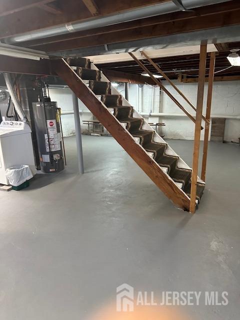 68 Suydam Ave, Edison, NJ 08817 - unfinished basement with gas water heater, stairway, and separate washer and dryer