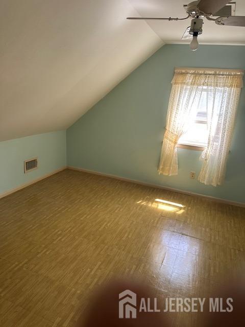 68 Suydam Ave, Edison, NJ 08817 - additional living space with lofted ceiling, a ceiling fan, and wood finished floors