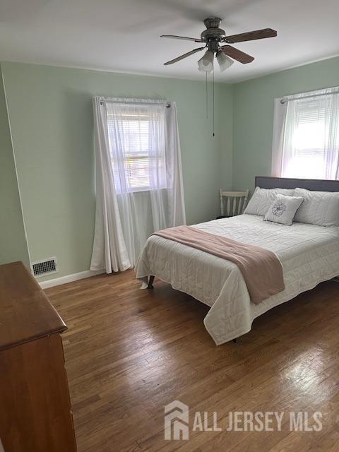 68 Suydam Ave, Edison, NJ 08817 - bedroom featuring multiple windows, wood finished floors, and ceiling fan