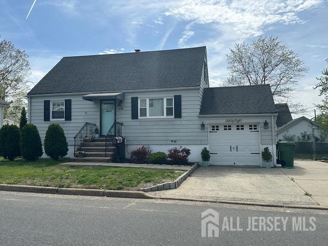 68 Suydam Ave, Edison, NJ 08817 - new england style home with concrete driveway, an attached garage, entry steps, and roof with shingles