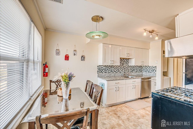 kitchen with decorative backsplash, stainless steel dishwasher, ornamental molding, and white cabinets