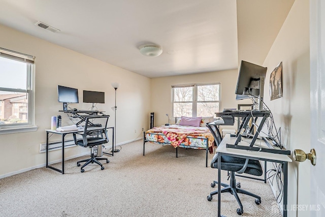 carpeted bedroom featuring baseboards and visible vents