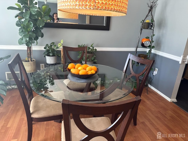 8 Bristol Dr, North Brunswick, NJ 08902 - dining room with wood finished floors and baseboards