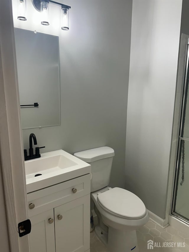 8 Bristol Dr, North Brunswick, NJ 08902 - bathroom featuring tile patterned floors, vanity, and a shower stall