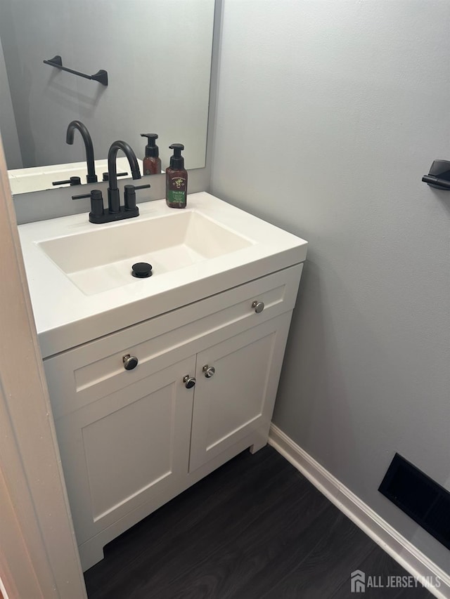 8 Bristol Dr, North Brunswick, NJ 08902 - bathroom featuring vanity and wood finished floors