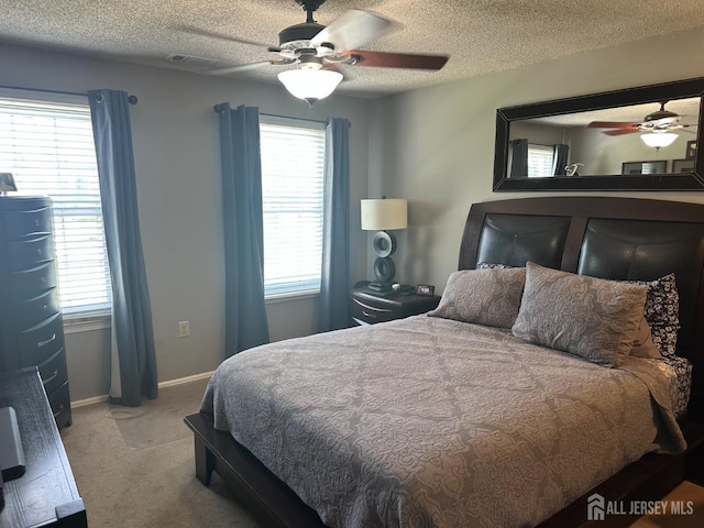 8 Bristol Dr, North Brunswick, NJ 08902 - bedroom featuring carpet floors, multiple windows, a ceiling fan, and a textured ceiling