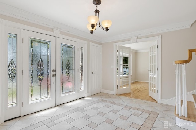 3 Cedar Ln, Milltown, NJ 08850 - foyer entrance featuring french doors, healthy amount of natural light, light tile patterned flooring, a chandelier, and ornamental molding