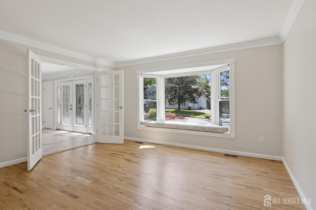 3 Cedar Ln, Milltown, NJ 08850 - empty room featuring french doors, ornamental molding, and light wood-type flooring
