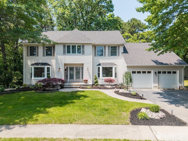 3 Cedar Ln, Milltown, NJ 08850 - colonial-style house featuring a garage, asphalt driveway, a front yard, and roof with shingles