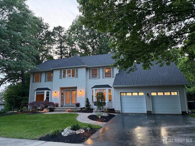 3 Cedar Ln, Milltown, NJ 08850 - view of front of home with driveway, an attached garage, a front lawn, and a shingled roof