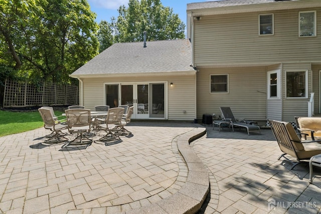 3 Cedar Ln, Milltown, NJ 08850 - rear view of house with a patio, french doors, roof with shingles, and outdoor dining space