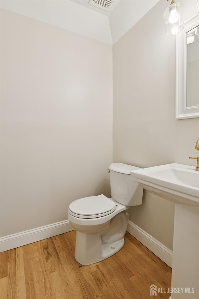 3 Cedar Ln, Milltown, NJ 08850 - half bath with toilet and wood finished floors
