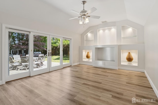 3 Cedar Ln, Milltown, NJ 08850 - unfurnished living room with wood finished floors, lofted ceiling, a ceiling fan, and french doors