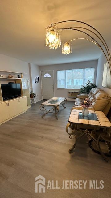46 Gramercy Gdns, Middlesex, NJ 08846 - living area featuring wood finished floors and a chandelier