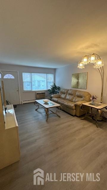 46 Gramercy Gdns, Middlesex, NJ 08846 - living room featuring wood finished floors, baseboard heating, and a chandelier