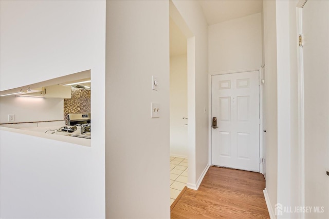 hall with light hardwood / wood-style flooring