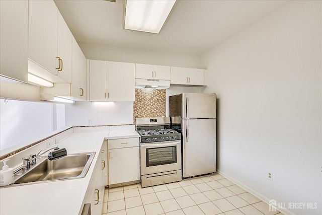 kitchen with white cabinetry, sink, light tile patterned floors, and appliances with stainless steel finishes