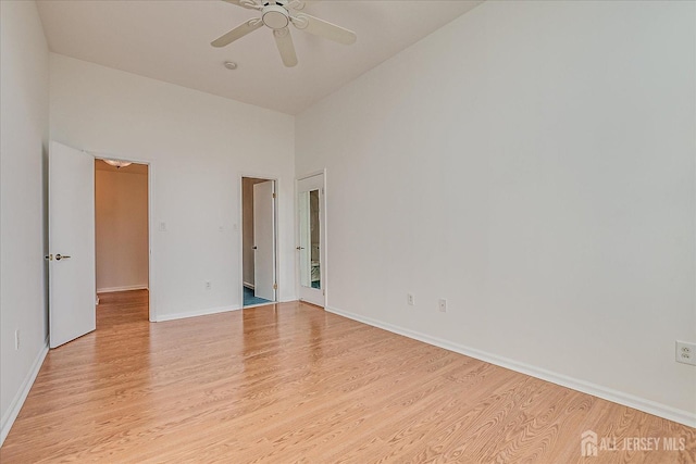 empty room featuring light hardwood / wood-style flooring and ceiling fan