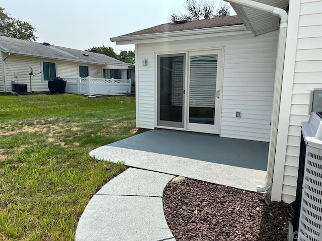 view of yard featuring central AC and a patio area