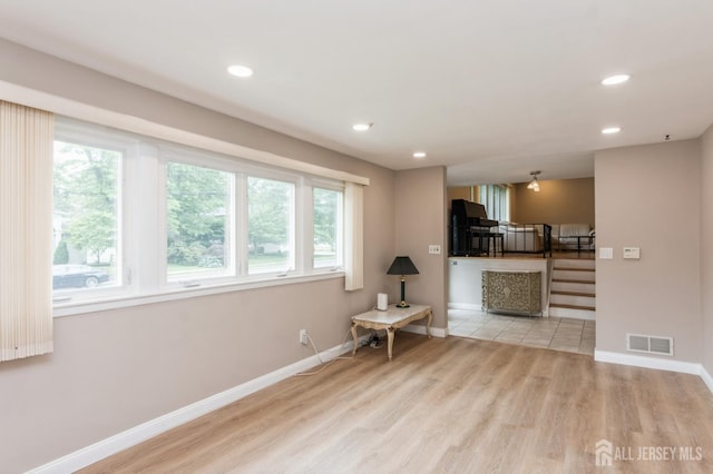 14 Agate Rd, East Brunswick, NJ 08816 - living area with stairs, wood finished floors, baseboards, and recessed lighting