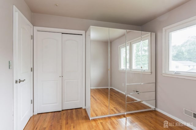 14 Agate Rd, East Brunswick, NJ 08816 - unfurnished bedroom with wood finished floors and baseboards