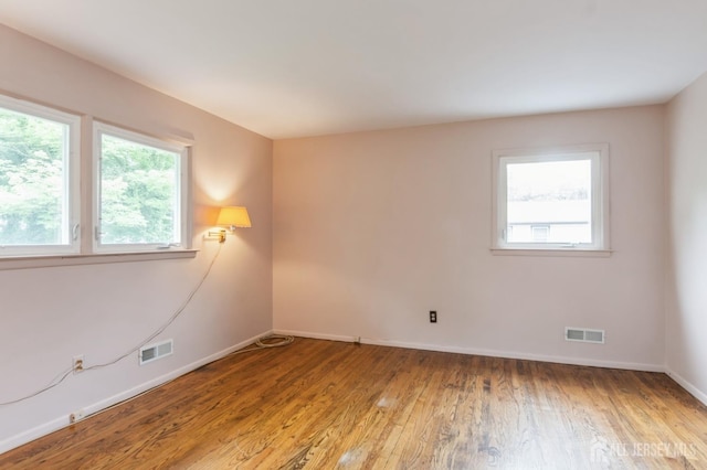 14 Agate Rd, East Brunswick, NJ 08816 - empty room featuring baseboards and wood finished floors