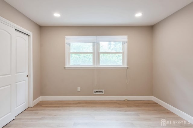 14 Agate Rd, East Brunswick, NJ 08816 - unfurnished bedroom with light wood-type flooring, baseboards, recessed lighting, and a closet