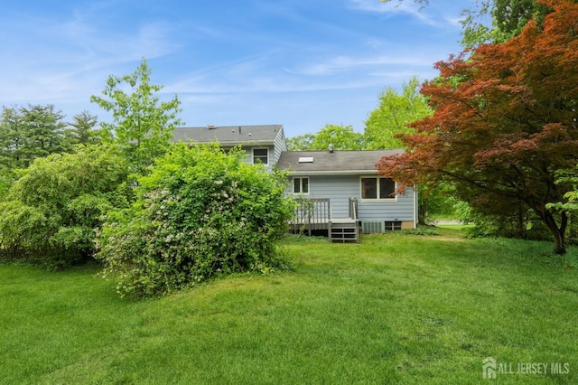 14 Agate Rd, East Brunswick, NJ 08816 - view of green lawn with a deck