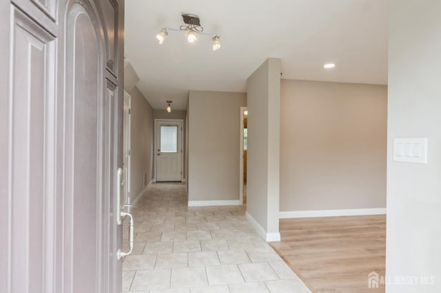 14 Agate Rd, East Brunswick, NJ 08816 - hallway with baseboards and light tile patterned floors