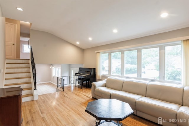 14 Agate Rd, East Brunswick, NJ 08816 - living room featuring light wood-type flooring, recessed lighting, vaulted ceiling, and baseboards