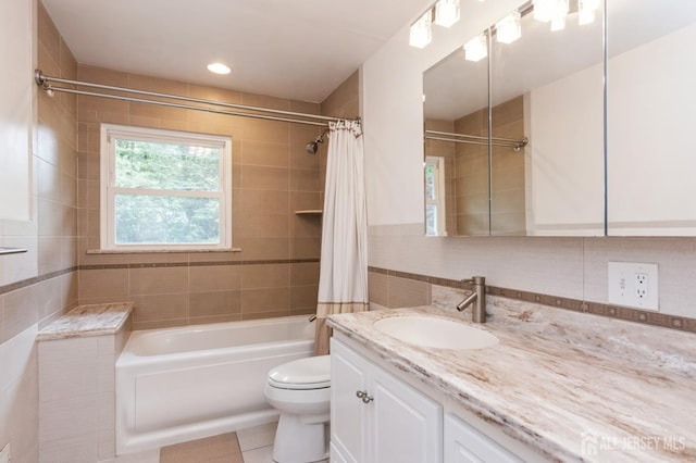 14 Agate Rd, East Brunswick, NJ 08816 - bathroom featuring vanity, toilet, shower / bathtub combination with curtain, tile patterned floors, and tile walls