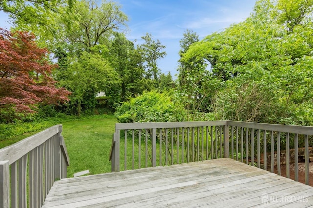 14 Agate Rd, East Brunswick, NJ 08816 - wooden deck featuring a lawn