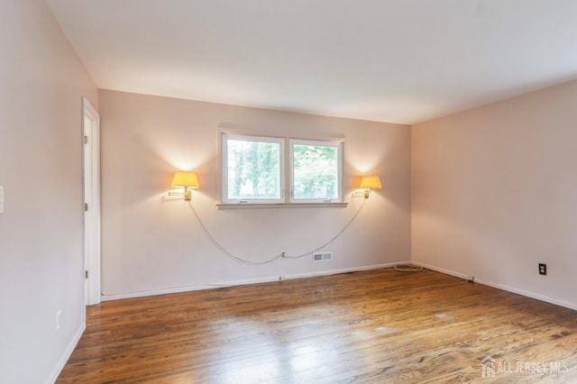 14 Agate Rd, East Brunswick, NJ 08816 - empty room featuring wood finished floors and baseboards