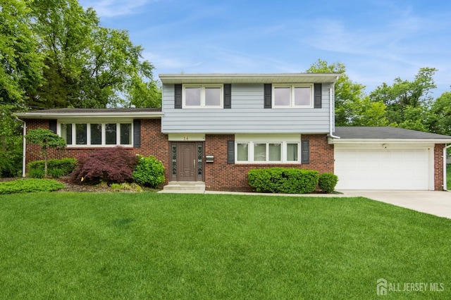 14 Agate Rd, East Brunswick, NJ 08816 - split level home with a garage, a front yard, driveway, and brick siding
