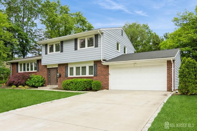 14 Agate Rd, East Brunswick, NJ 08816 - split level home featuring brick siding, a garage, a front lawn, and concrete driveway