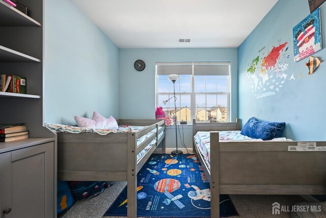 bedroom featuring carpet