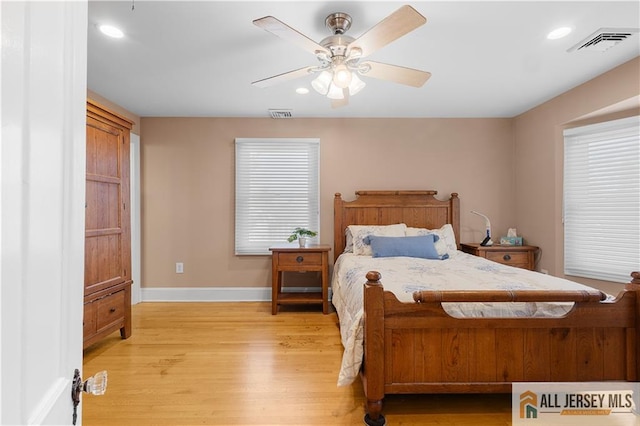 bedroom featuring ceiling fan and light hardwood / wood-style flooring