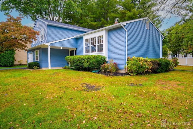 view of home's exterior featuring a yard