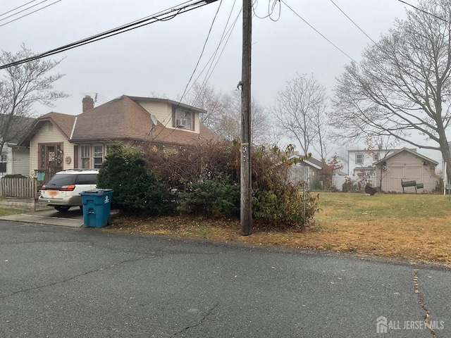 view of home's exterior with a lawn