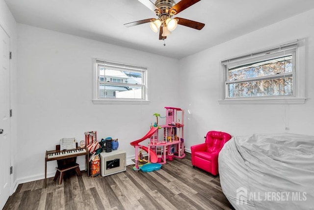 game room featuring hardwood / wood-style floors and ceiling fan