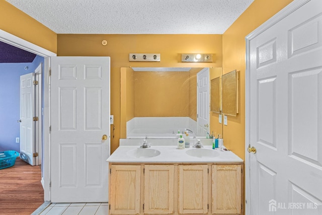 199 Prestwick Way, Edison, NJ 08820 - full bath with a textured ceiling, double vanity, a bath, and tile patterned floors